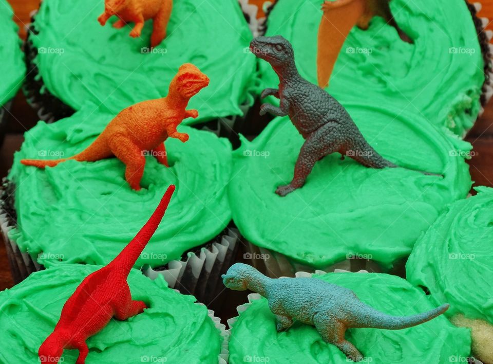 Dinosaur Cupcakes. Birthday Cupcakes Topped With Tiny Plastic Dinosaurs