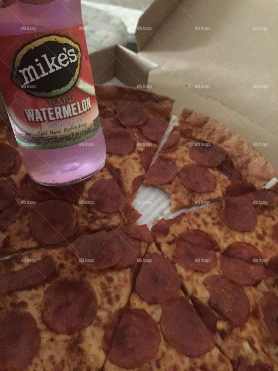 Enjoying a Mike’s hard watermelon lemonade with some delicious Pizza Hut Pizza! 