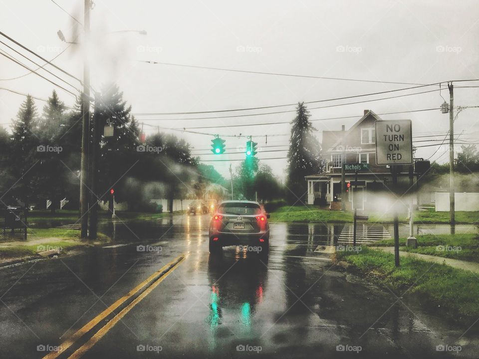 Driving in the rain, reflection on the asphalt 