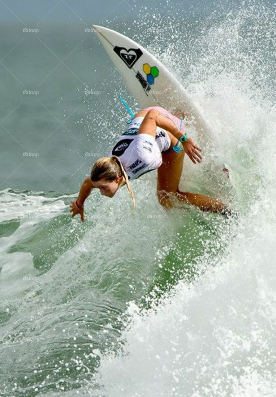 Woman surfing on surfboard