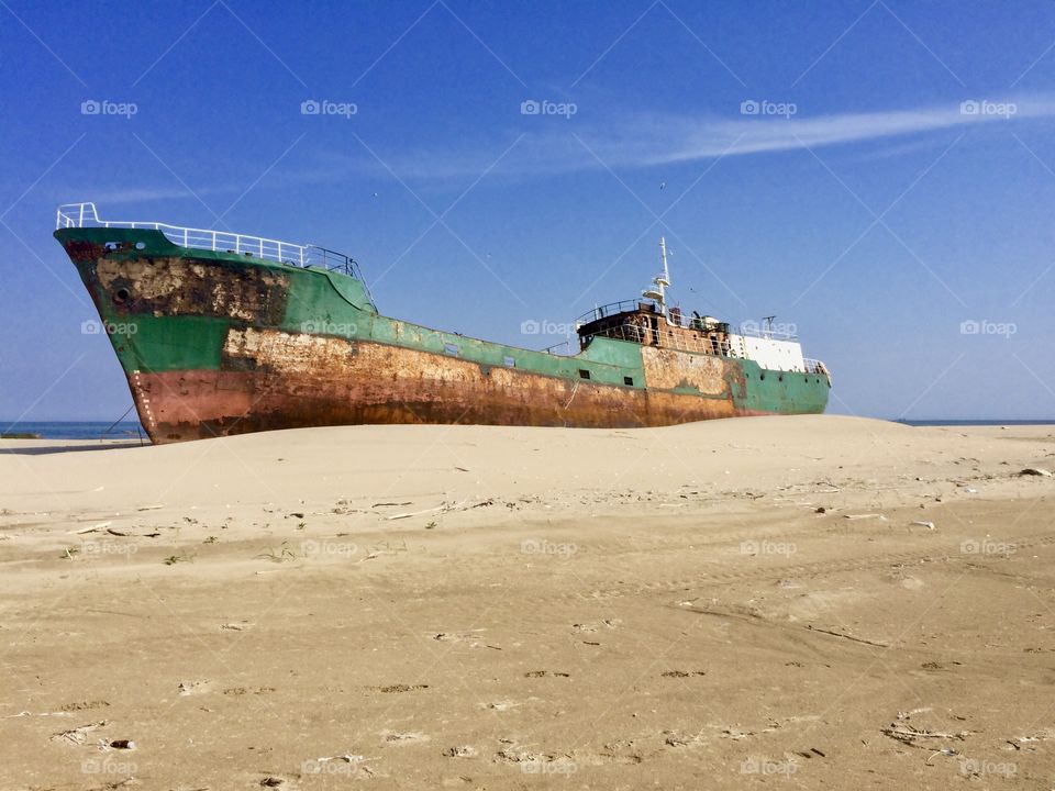 The ship thrown out on the sand dunes.