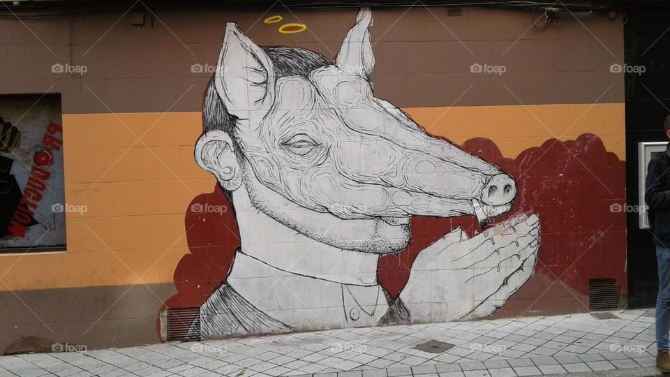 Visual Street Art: Praying man with pig mask