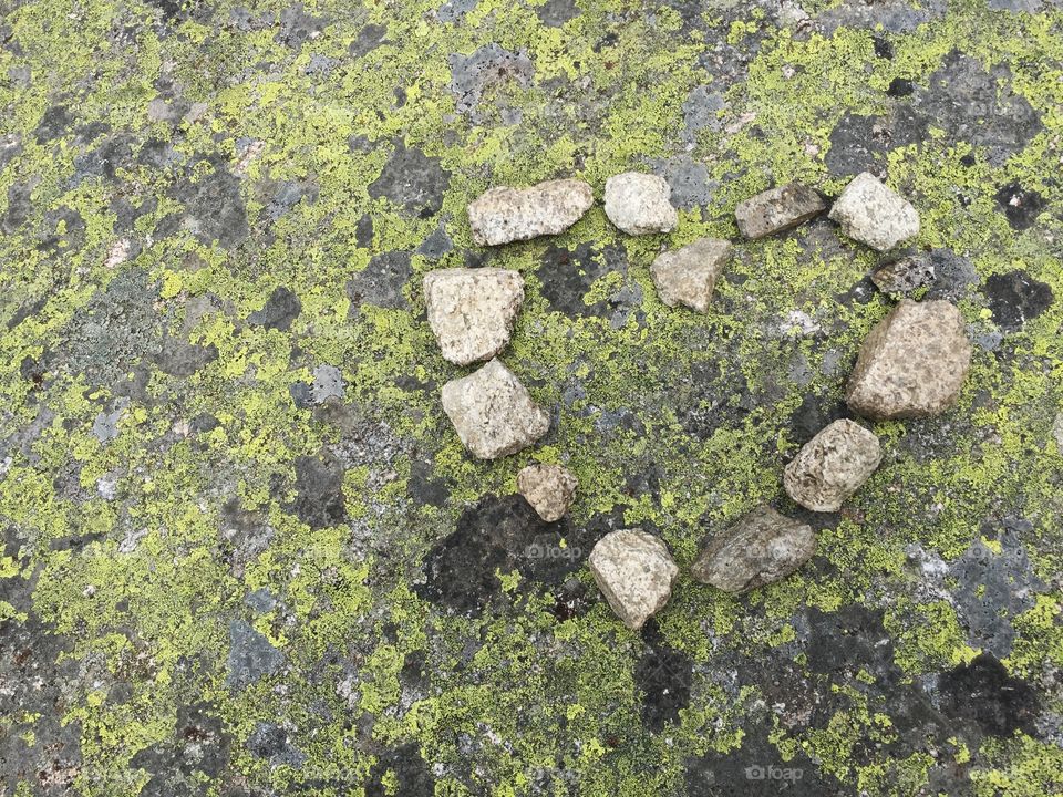 Heart shape made with stone mossy rock
