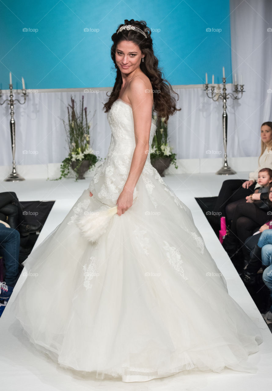 Fashion show at a wedding fair. Here are the latest dresses and clothes for both bride and groom.