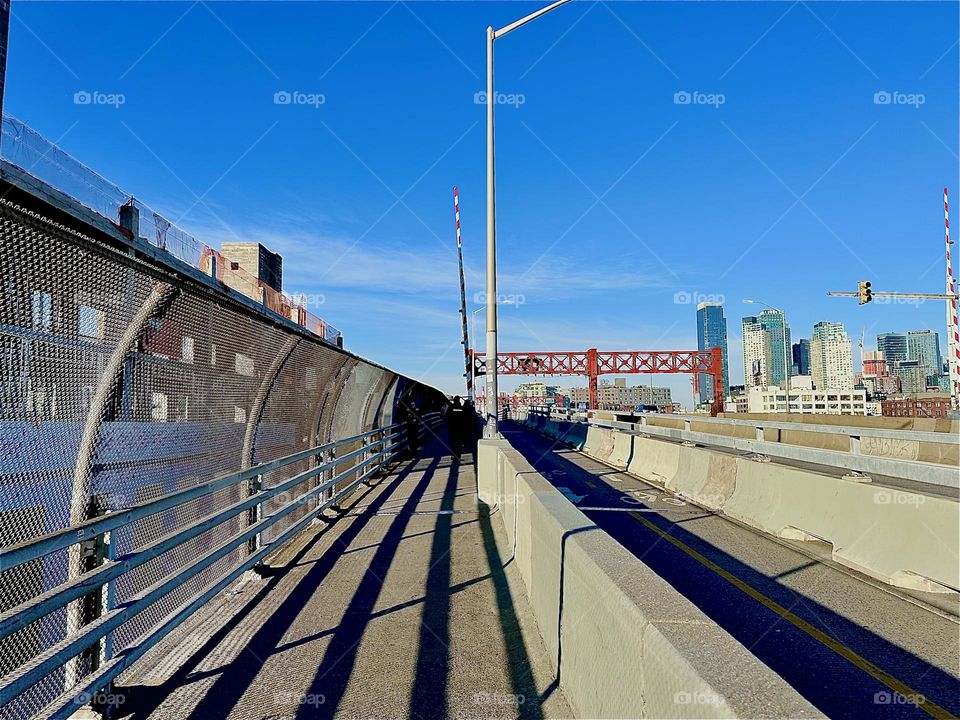 The “Pulaski Bridge” at “Newtown Creek” in LIC, Queens is truly a marvel of modern architectural design. Its streamlined elements also cast dramatic shadows that vary depending on the time of day. 2023. Hypnotic Productions