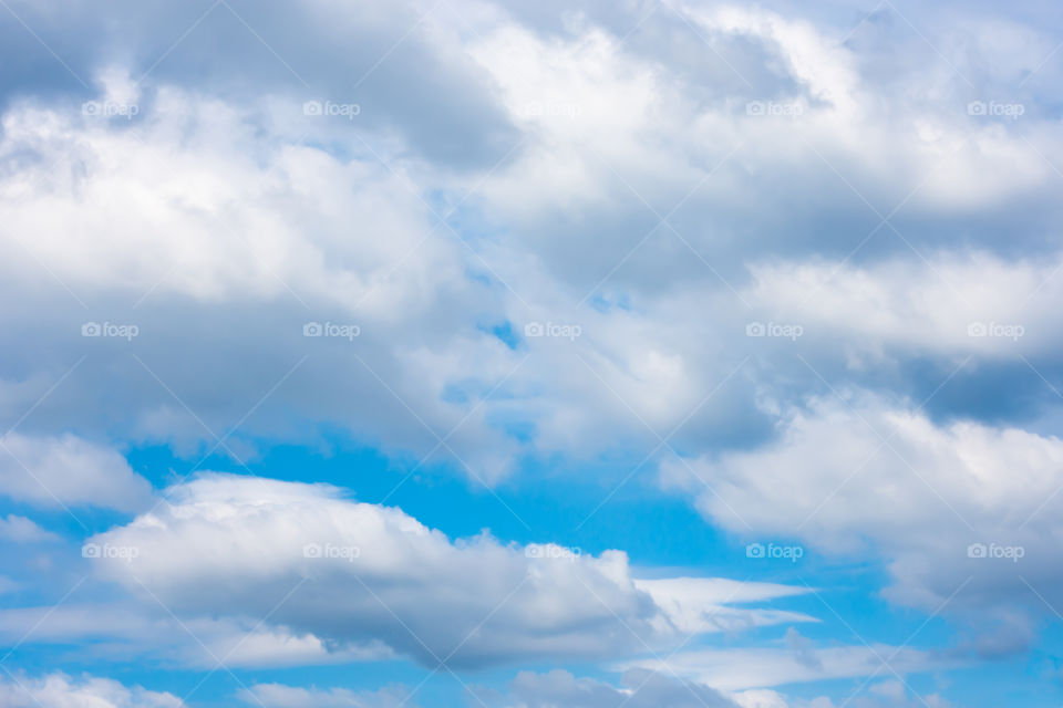 The beauty of the sky with clouds and the sun.