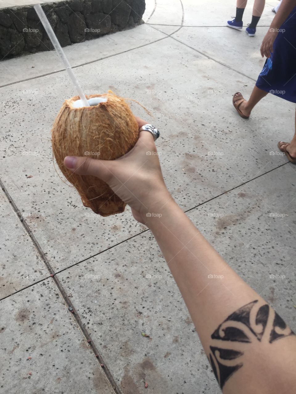 coconut water for a hot Hawaiian day plus temporary tribal tattoo. 