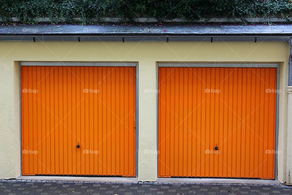 Two orange garage gates