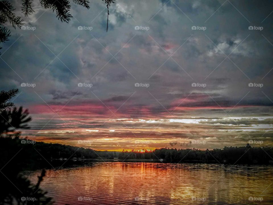 Scenic view of lake at dusk