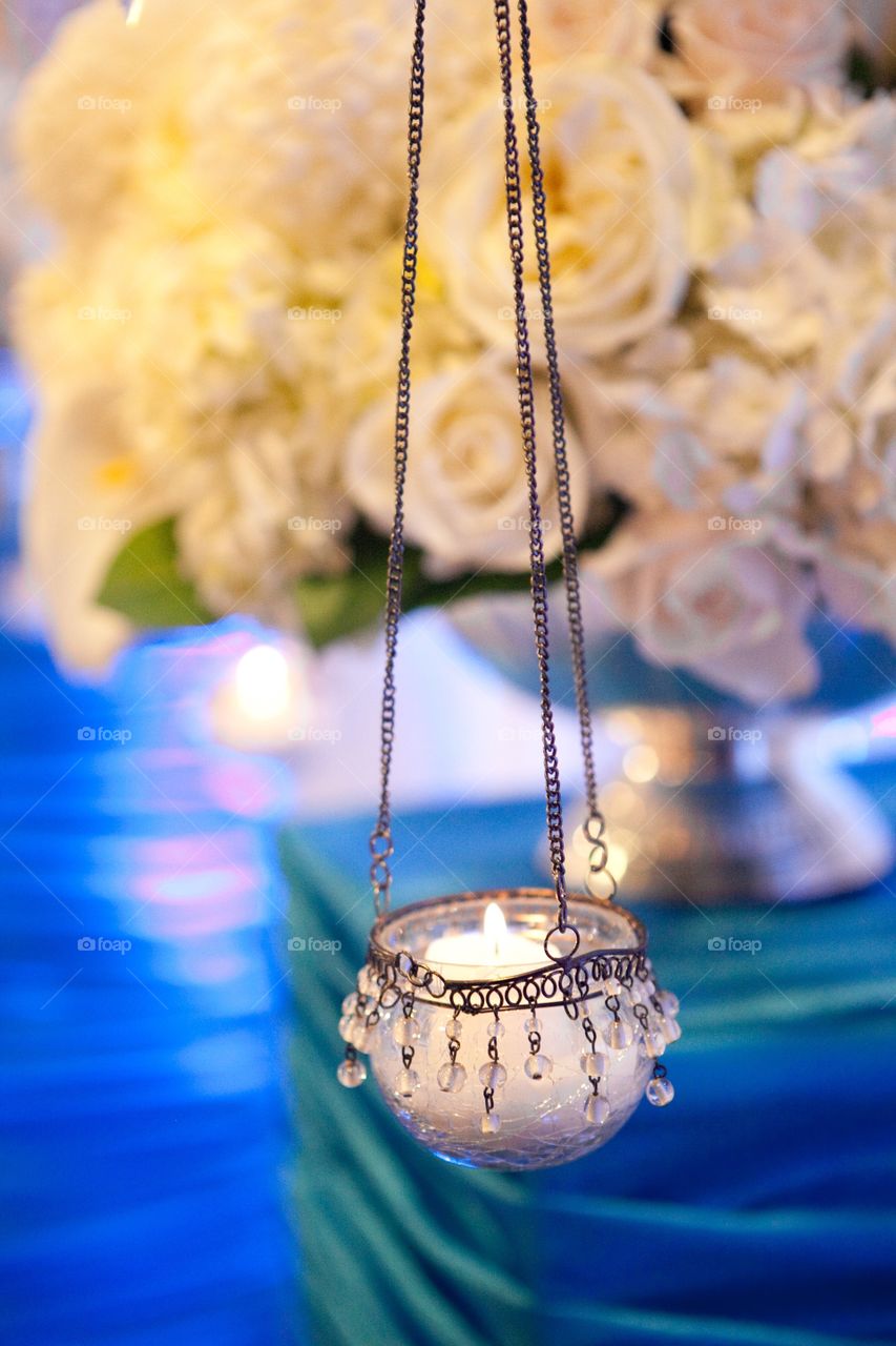 Hanging wax candle in glass jar 