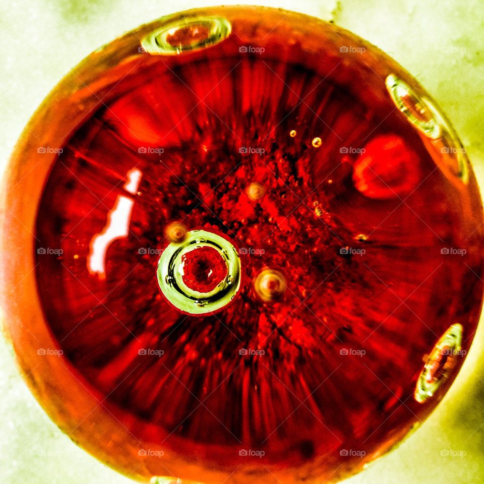 Abstract image of glass paperweight with red accent