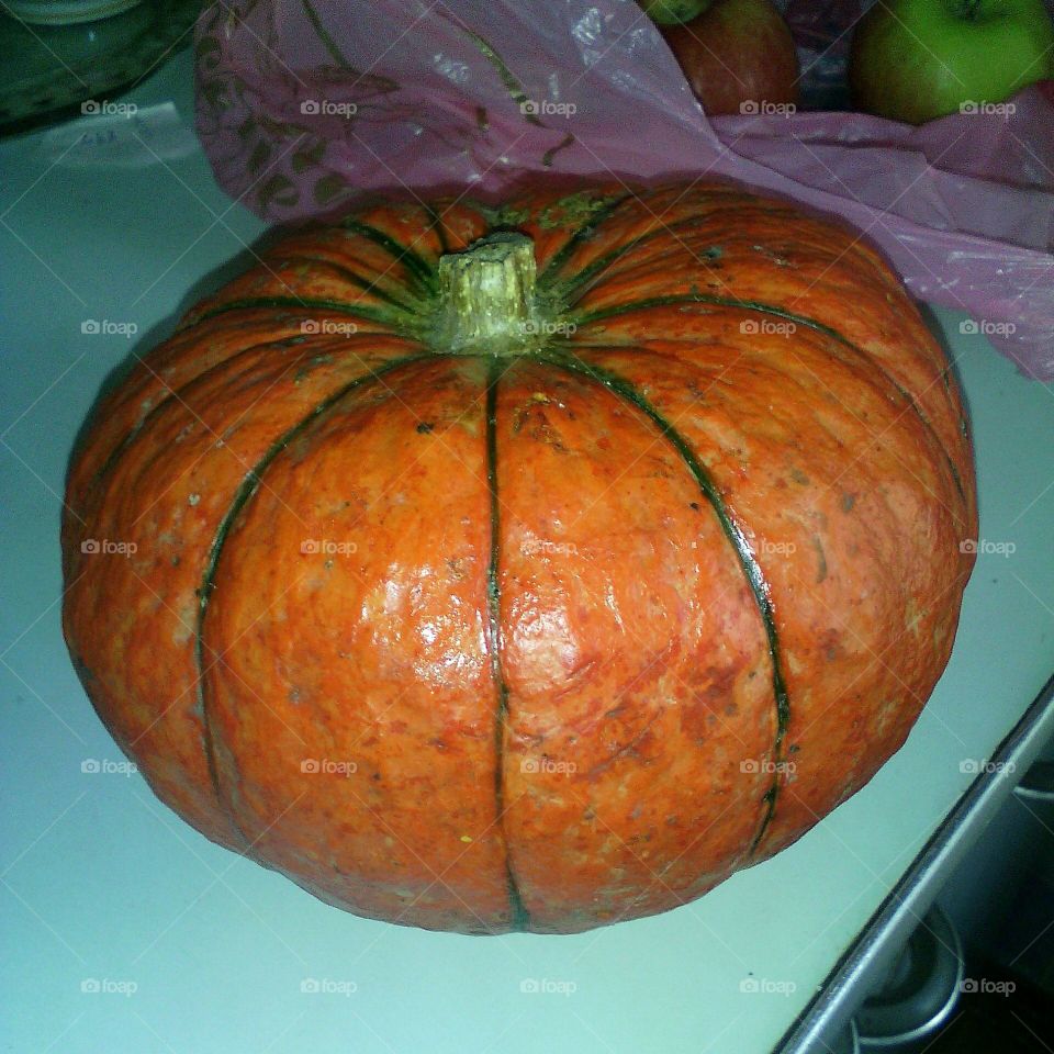 A bright orange pumpkin on the table