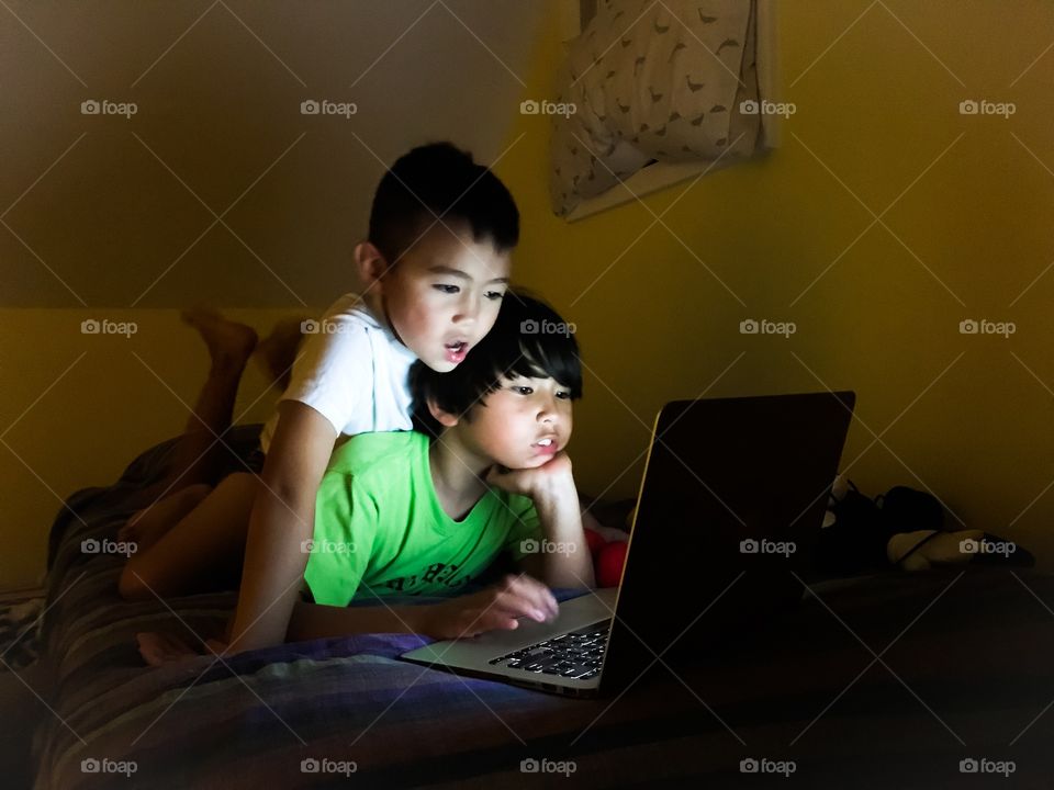 Brothers watching online videos