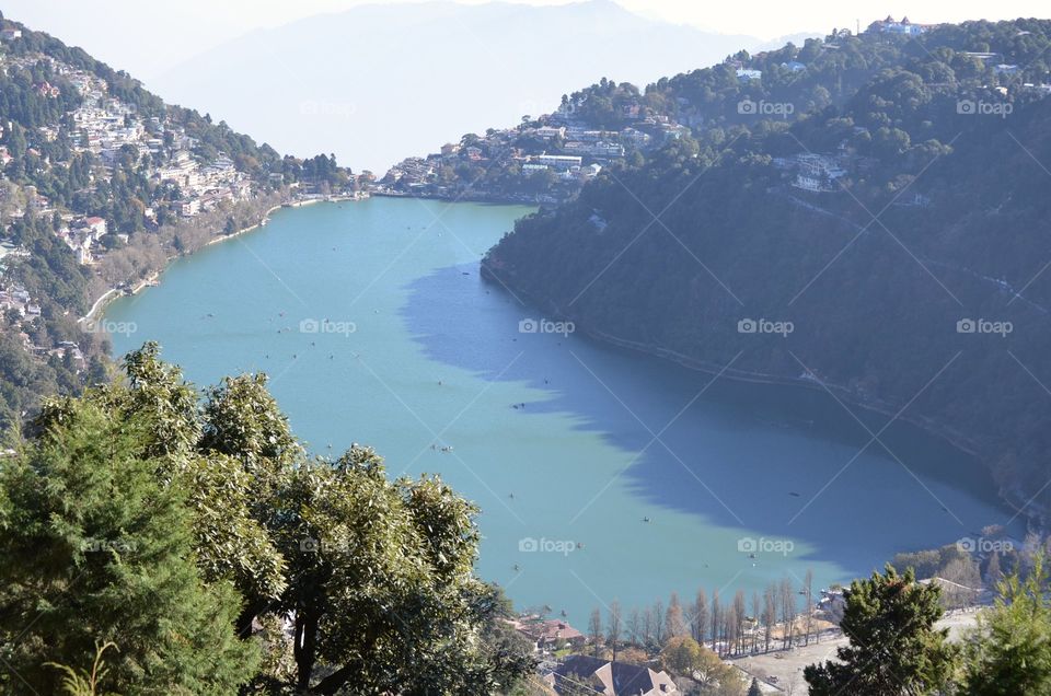 Naini Lake in Nainital in India. This is an eye shaped natural lake in the beautiful hill Station named Nainital in India. The lake is very deep and water very clean and situated in lap of Himalayas.