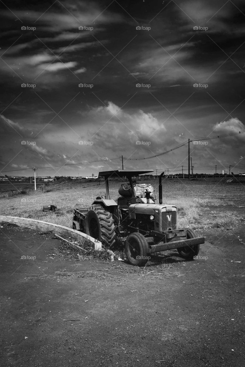 Black and White shot of a Tractor on a Brazilian rural Landscape, near the city of Rio Claro.