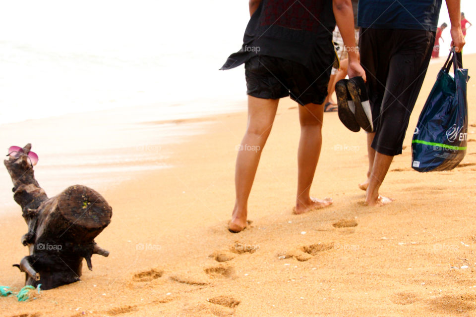 Couple footprints on seashore sand