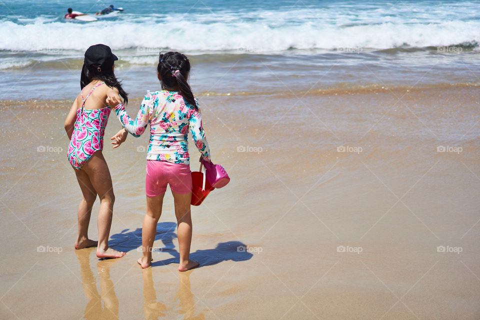 Kids playing at the shore in Bondi Beach
