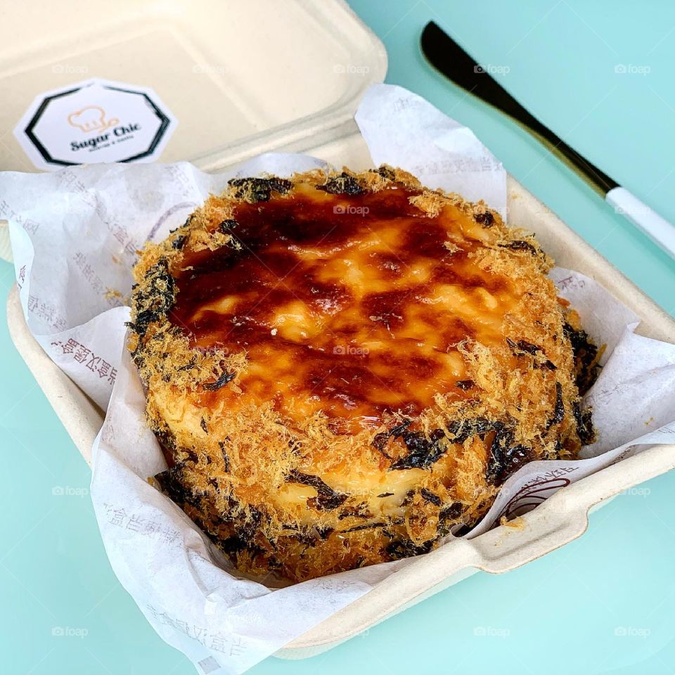 Homebaked pork floss sponge cake with salted egg sauce and cheese 