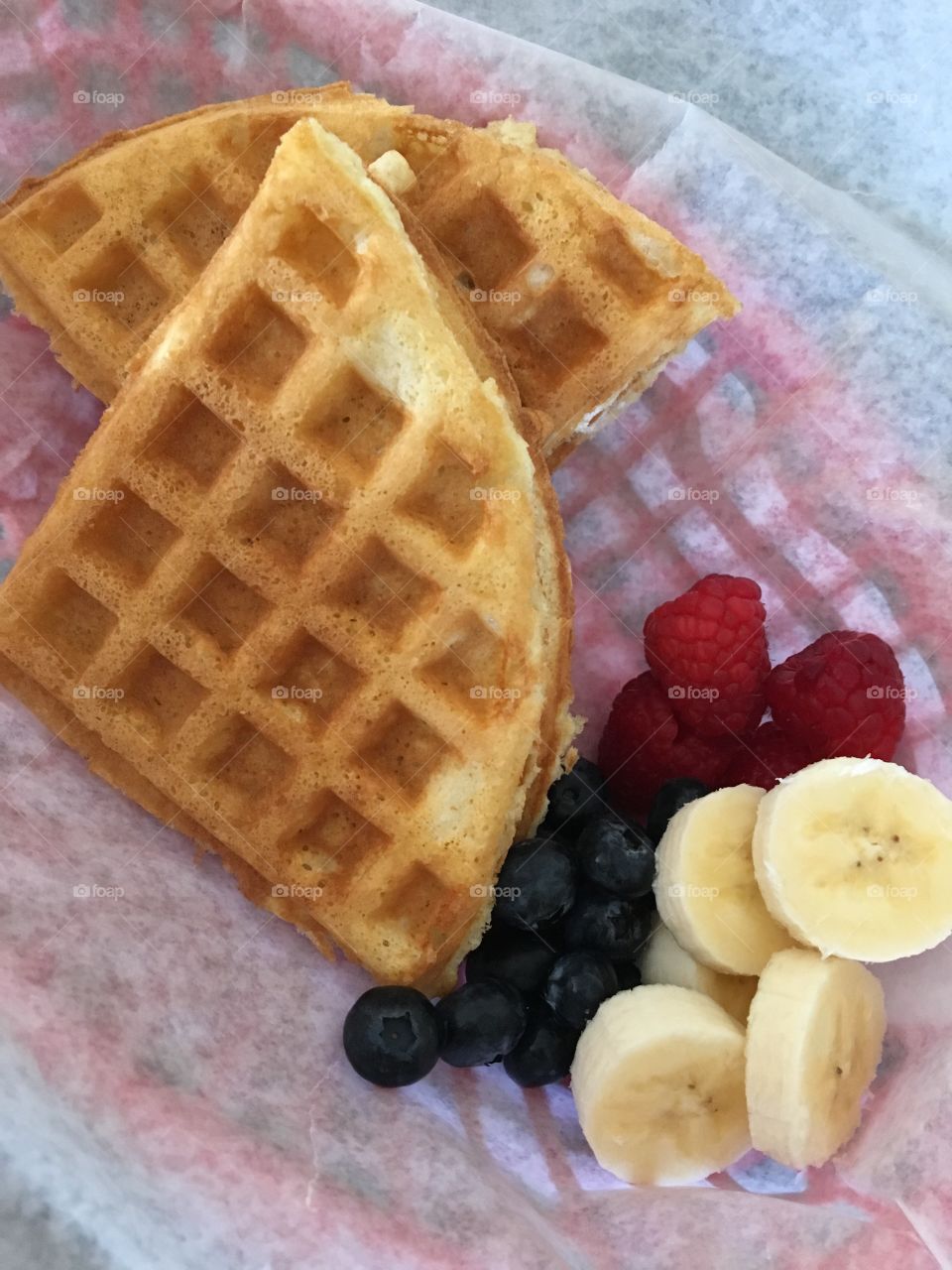 Homemade Waffle Peanut Butter and Jelly Sandwich in a basket 