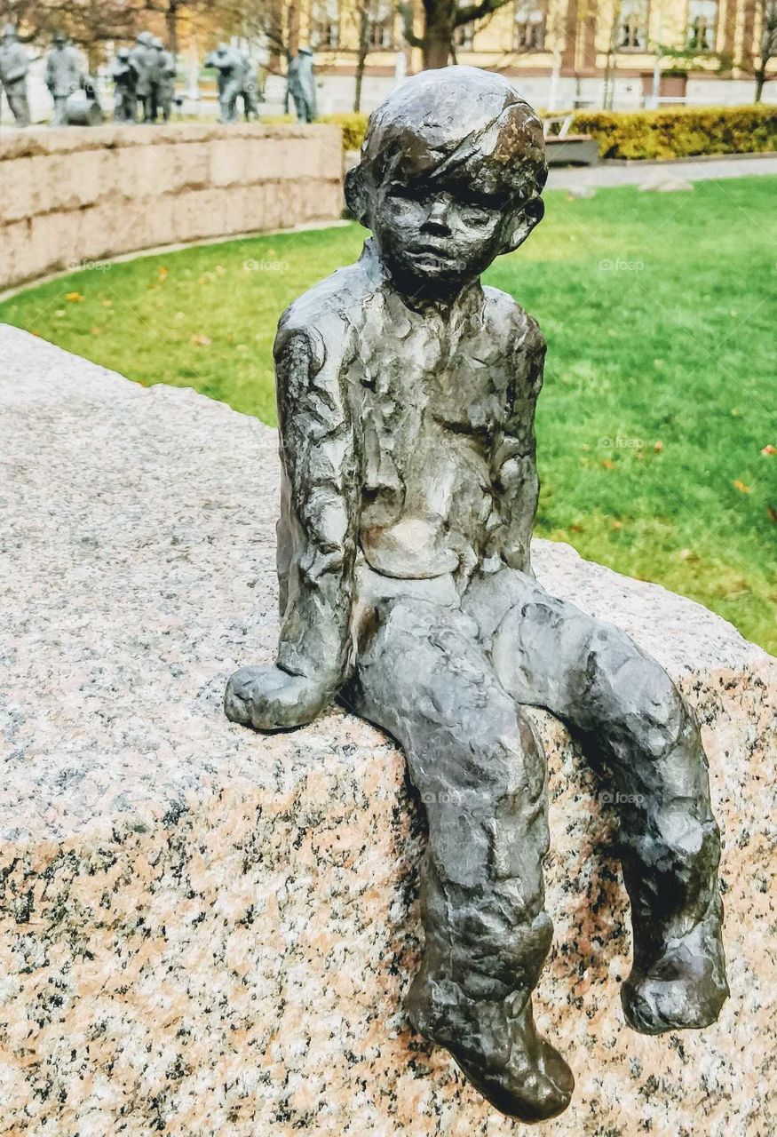 Small boy statue in Oulu, Finland