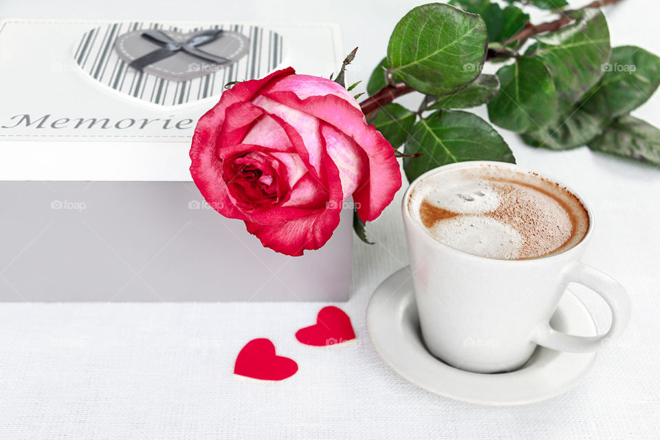 cup of coffee and a rose