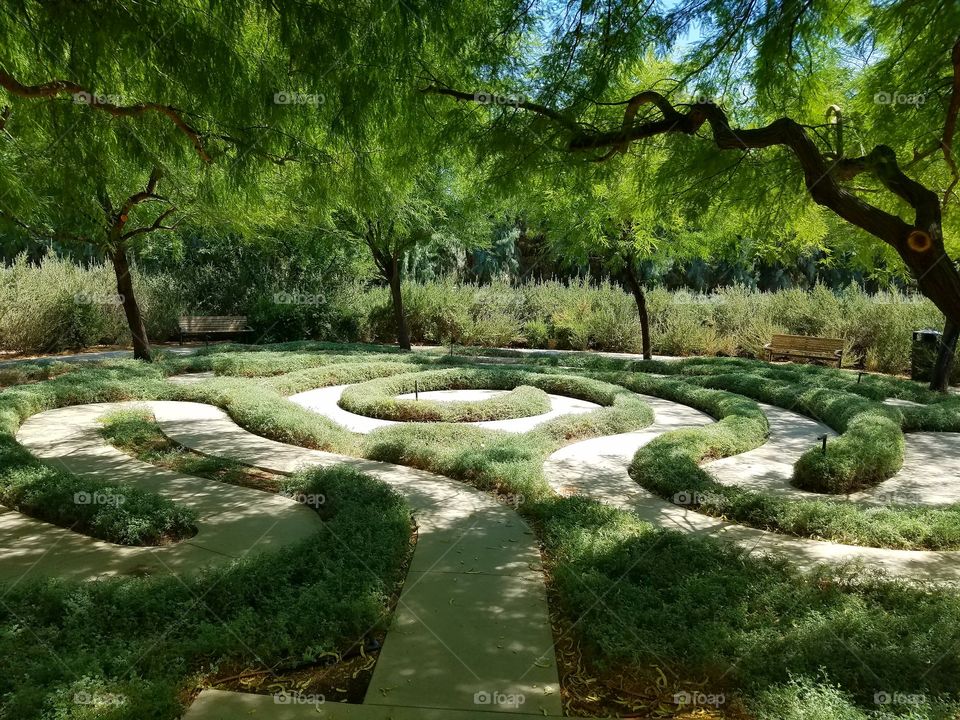 Swirling maze path through a pretty garden, California