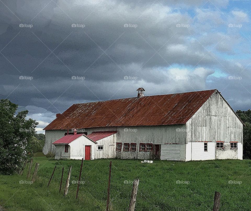 Barn on a cloudy day summer country life