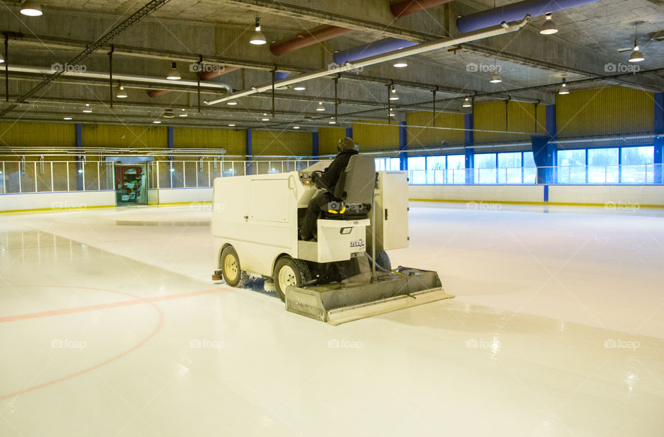 Ice resurfacing machine in work.
