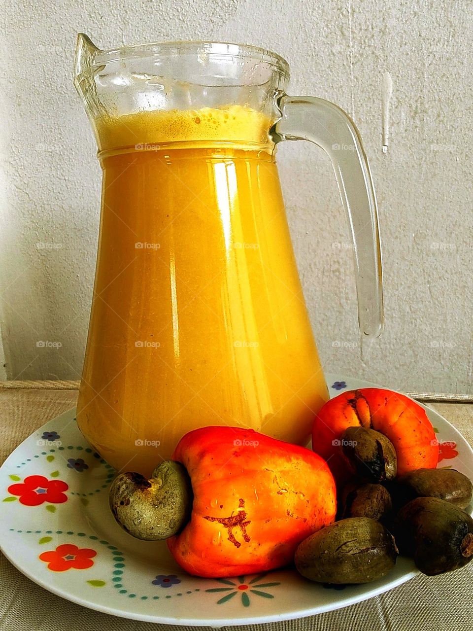 a delicious cashew juice, in addition to being refreshing, is very good for health.  A pitcher of cashew juice that was harvested early in the morning.