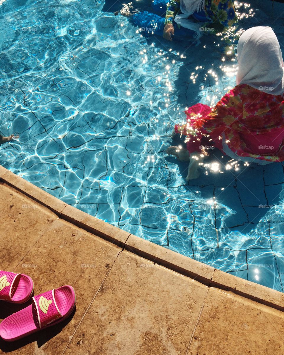 Woman enjoying in swimming pool