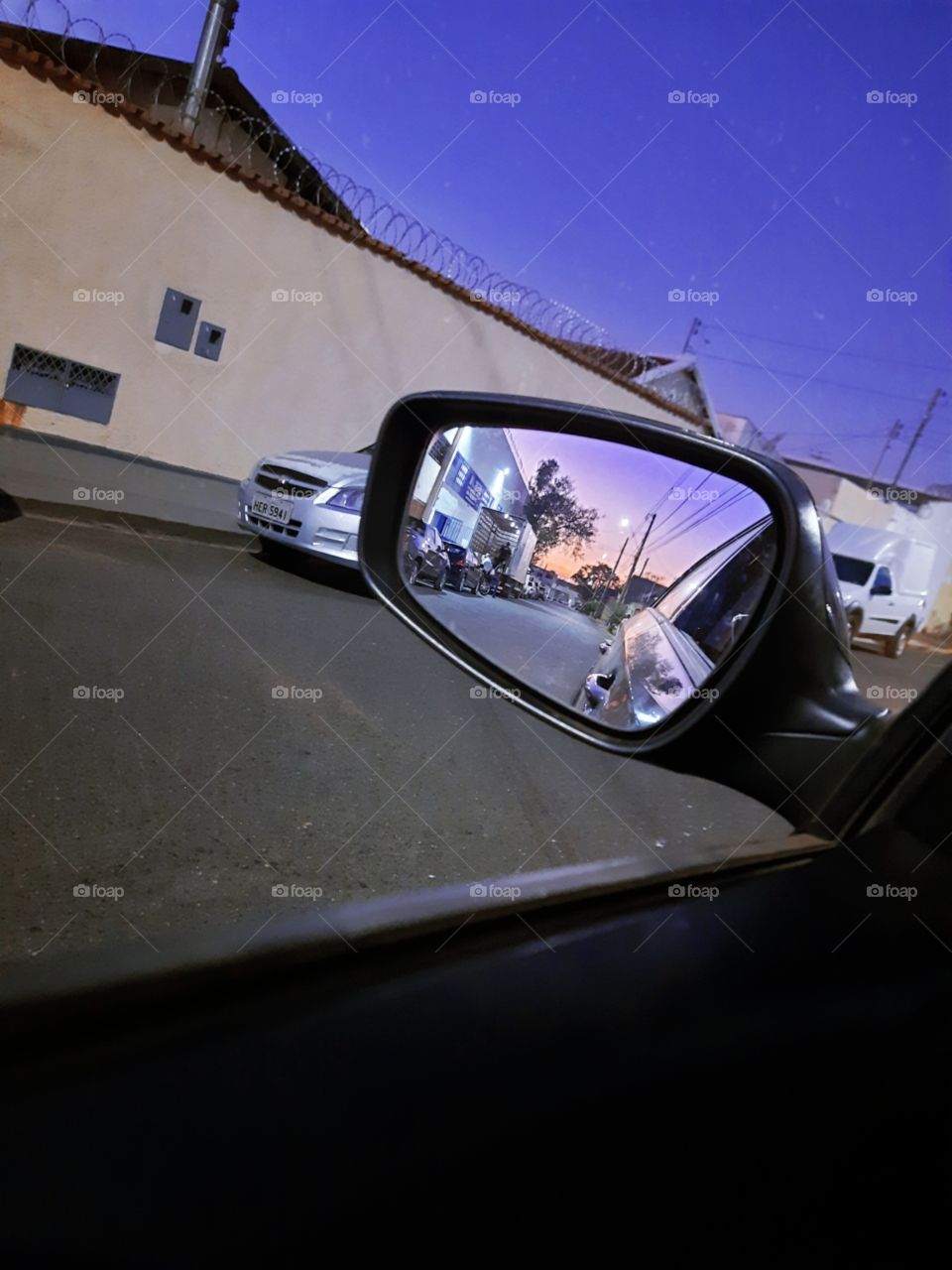 sunset image through car window and car rear view