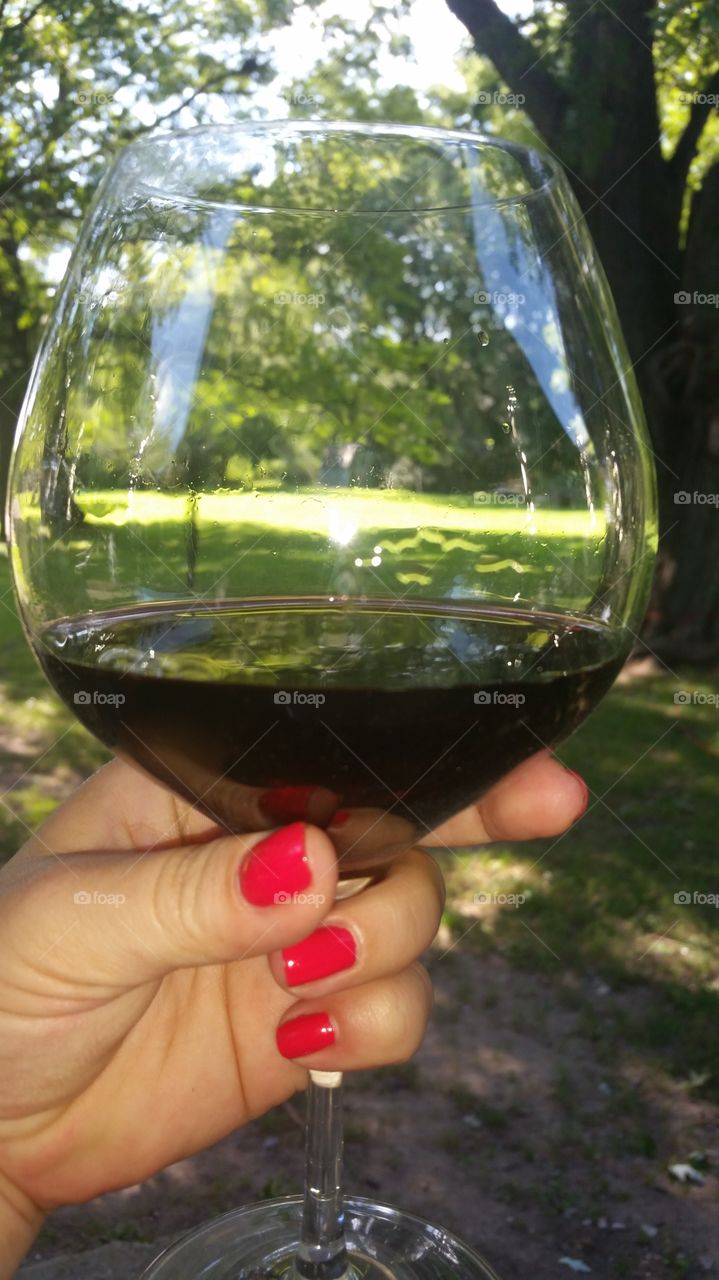red red wine. enjoying a summer afternoon in the back yard w a glass of sangiovese