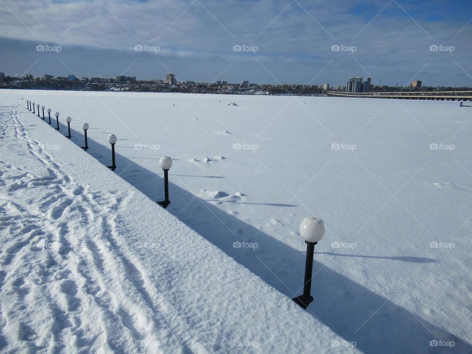 river under snow, winter, frost, ice, the sun shines but does not warm, February winter month