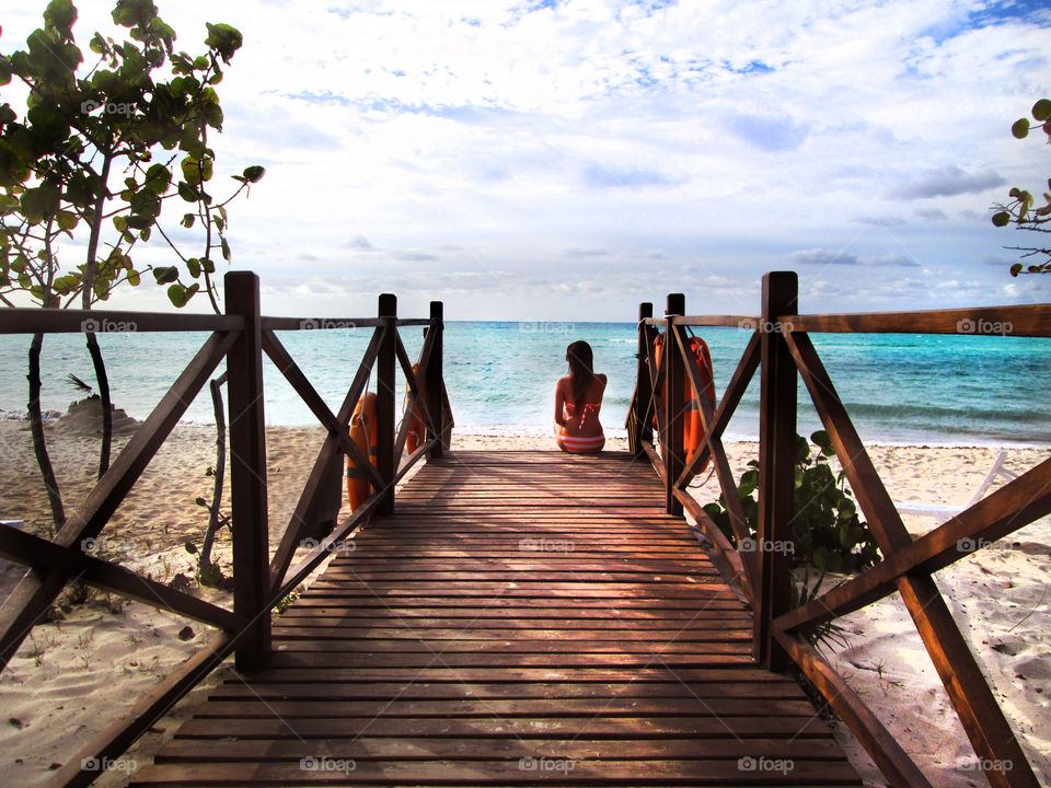 wait for you on the beach. she did waiting her boyfriend long time