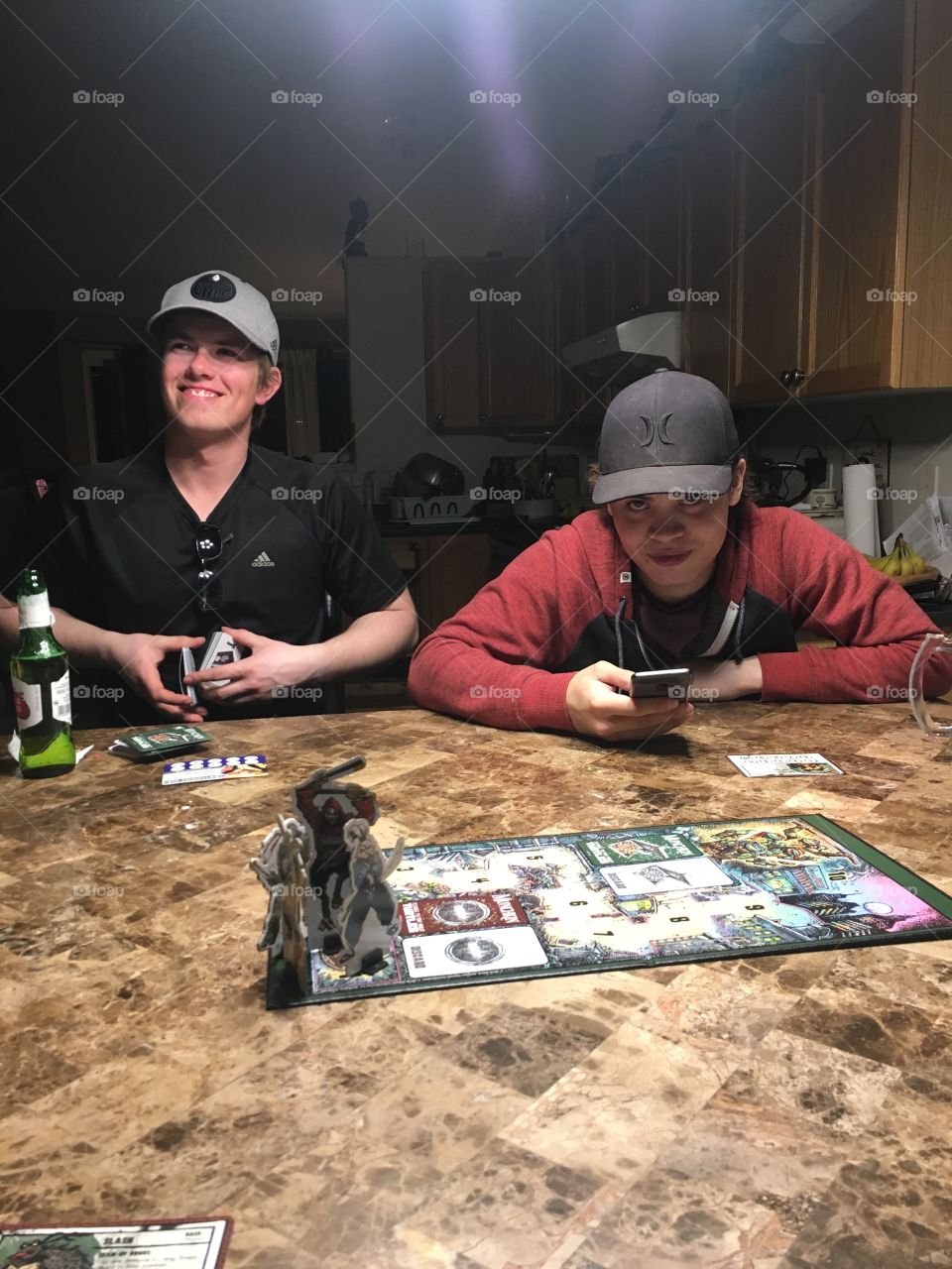 Playing Munchkin board and card game with friends 