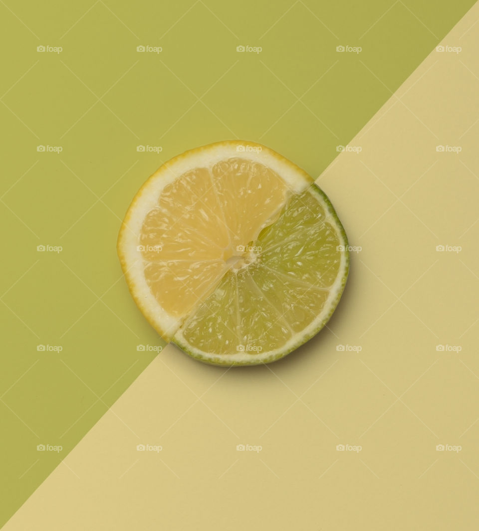 Slice of lemon and lime creating full circle
