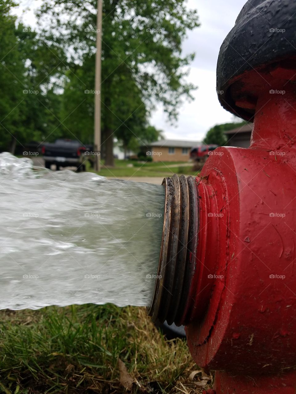 water flowing from fire hydrant closeup