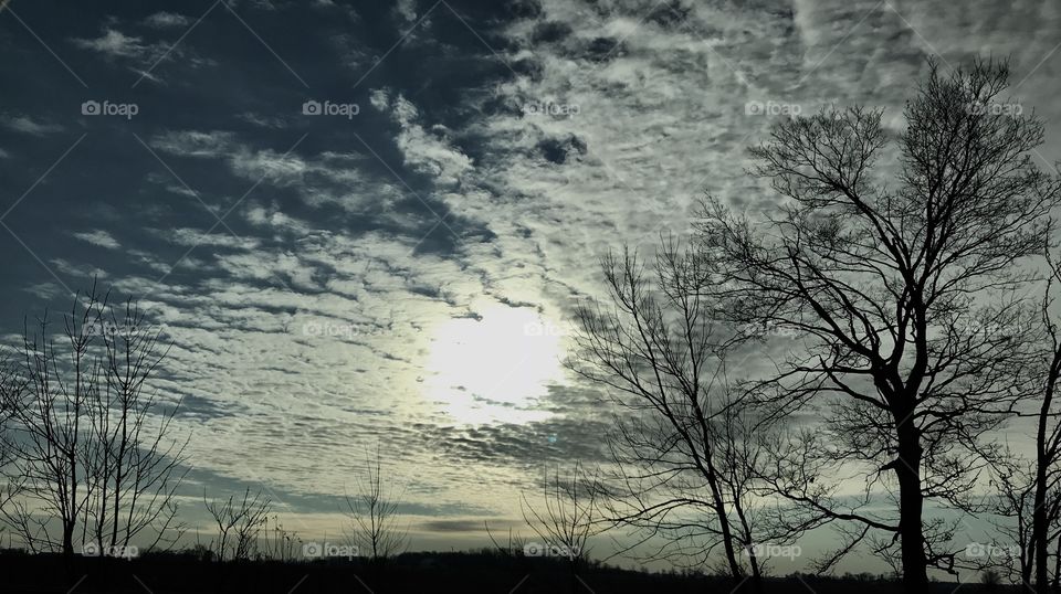 Clouds and sun  on a cold morning