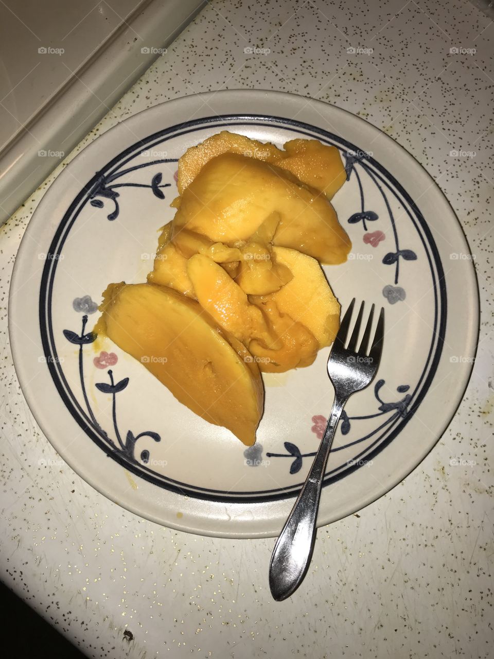 Cut-up mango for dessert after dinner. This fruit makes quite a healthy dessert. It contains natural sweet and is refreshing when consumed.