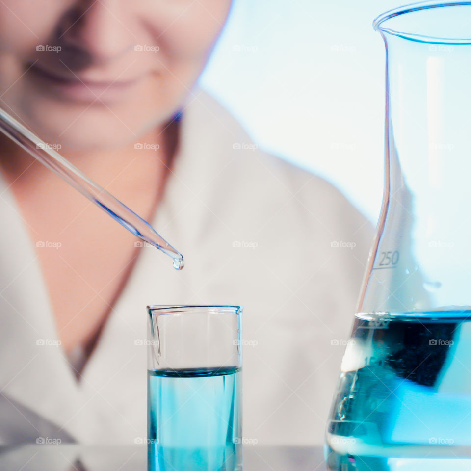 Laboratory scientist working at lab with test tubes