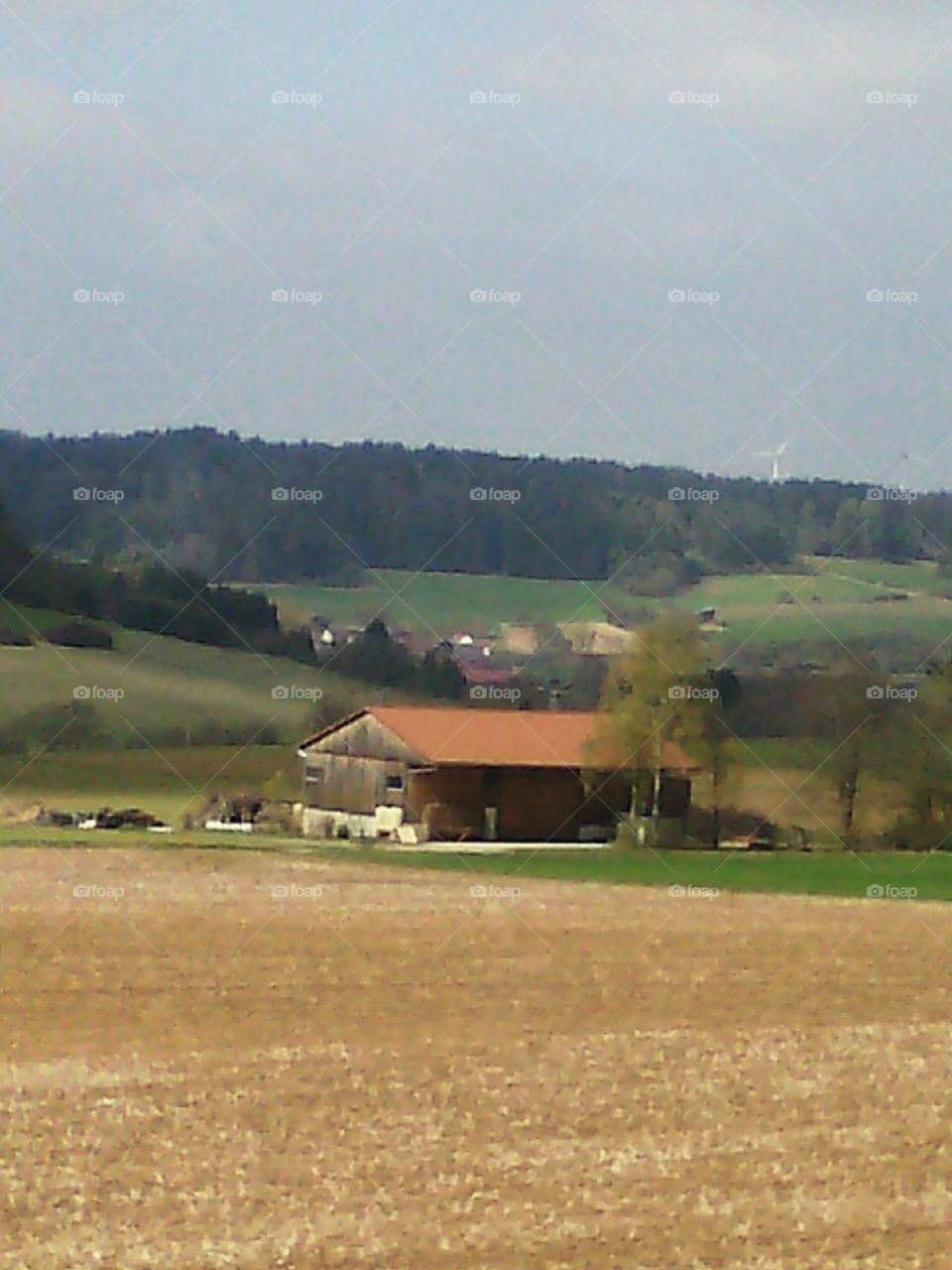 a big farm in the green fields of Germany
