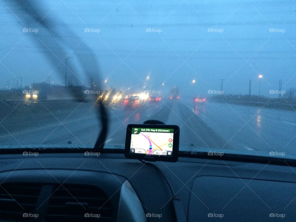 Travelling in a storm with the gps in the foreground.