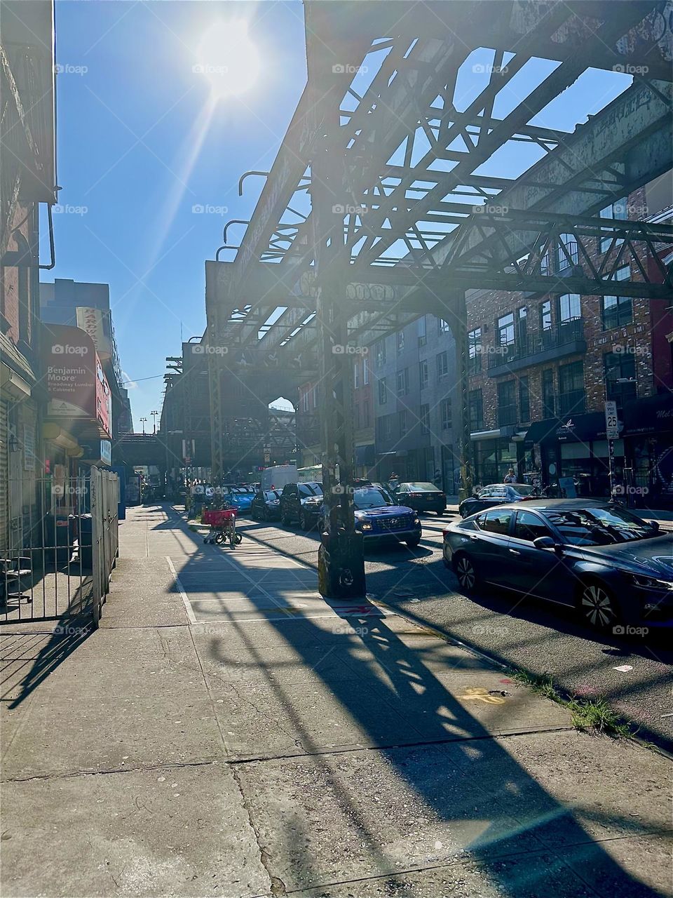 While walking towards the “Broadway” intersection on “Myrtle Ave” in “Bushwick”, Bklyn elaborate elongated shadows unfold cast onto the asphalt by the late afternoon gleaming sun. 2024. Hypnotic Productions