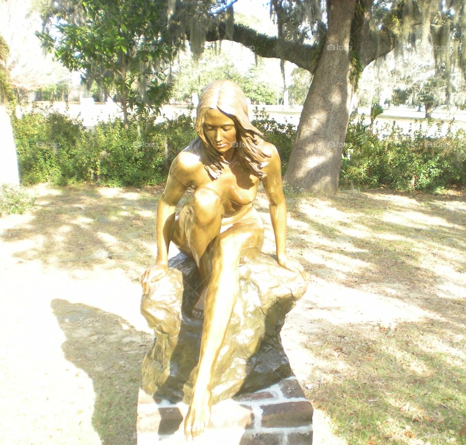 taking a dip. bronze statue