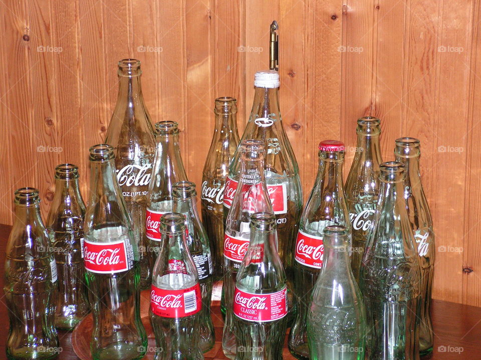 Glass Coca-Cola bottle old and new