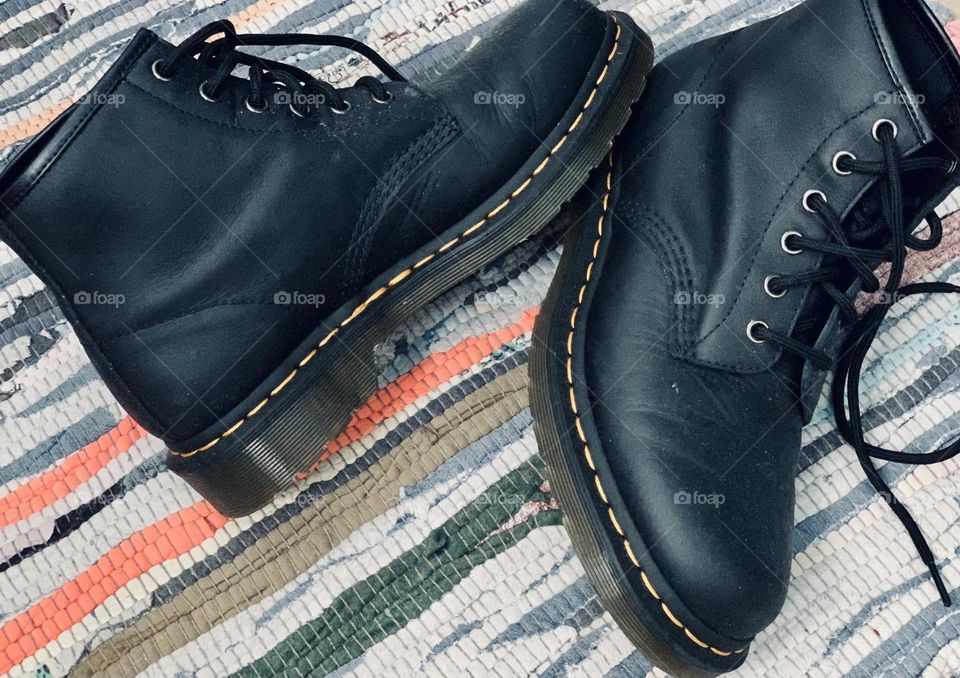 Leather Dr martin on colourful rug