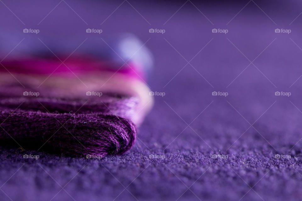 Skeins of purple thread of different tones