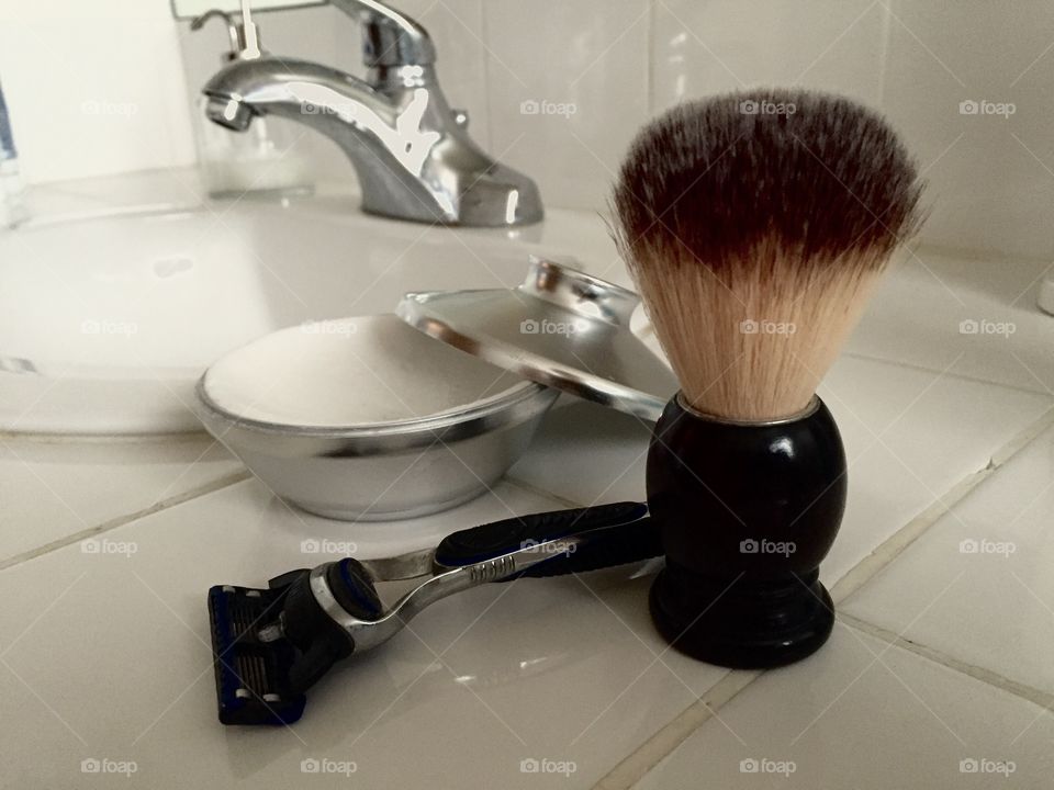 Men's shaving soap, brush, and razor. 