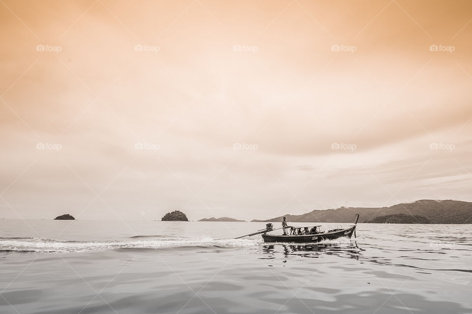 Idyllic view of boat and people in boat