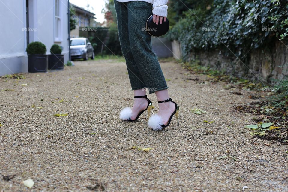 sexy trendy fluffy high heels on a stylish blogger woman